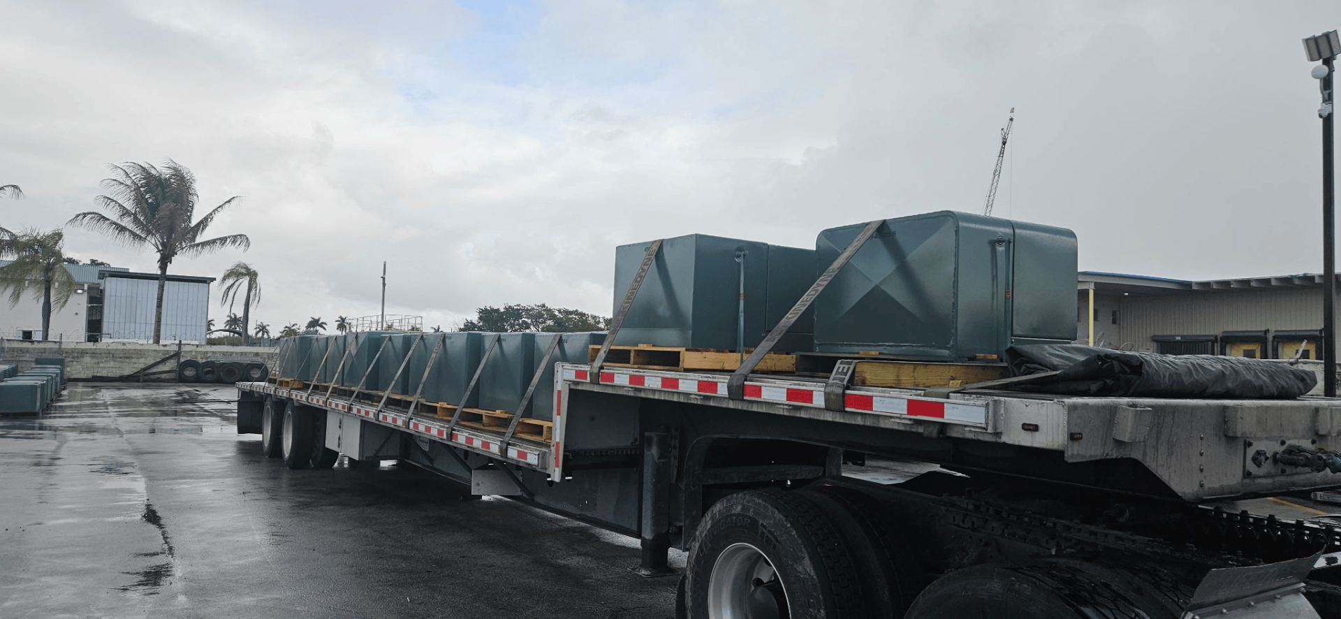 Distribution transformers loaded on flatbed truck for delivery